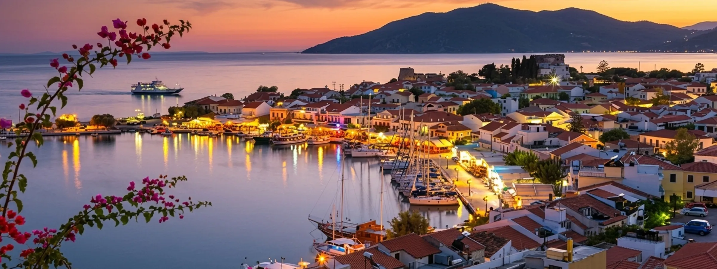 Samos harbor illuminated at sunset with yachts, boats, and a ferry near the coastal town in Greece.