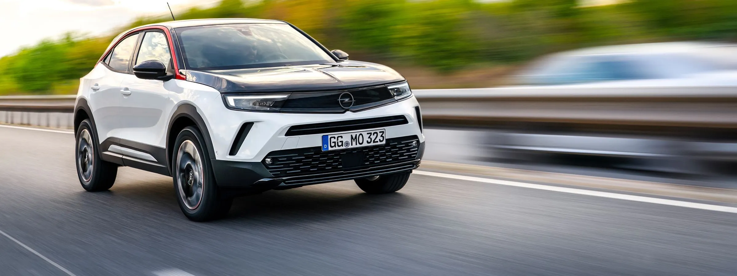 Opel SUV rental car driving on highway with dynamic background motion blur effect.